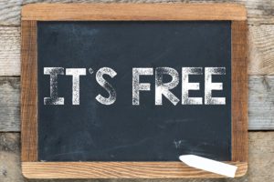 A Photo of a chalkboard with the words "It's Free" written on it